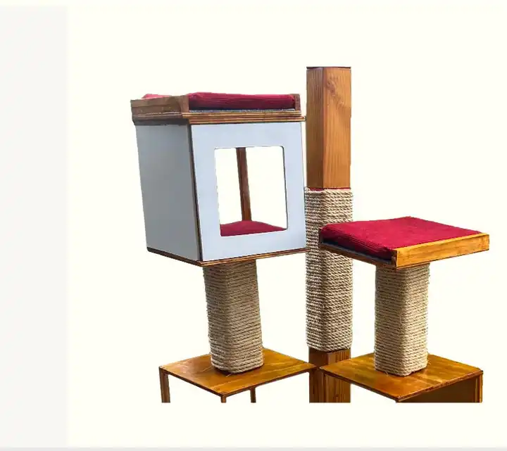 The revised cat tree: a white cube nest with a window, a red cushioned platform, and rope-wrapped posts.